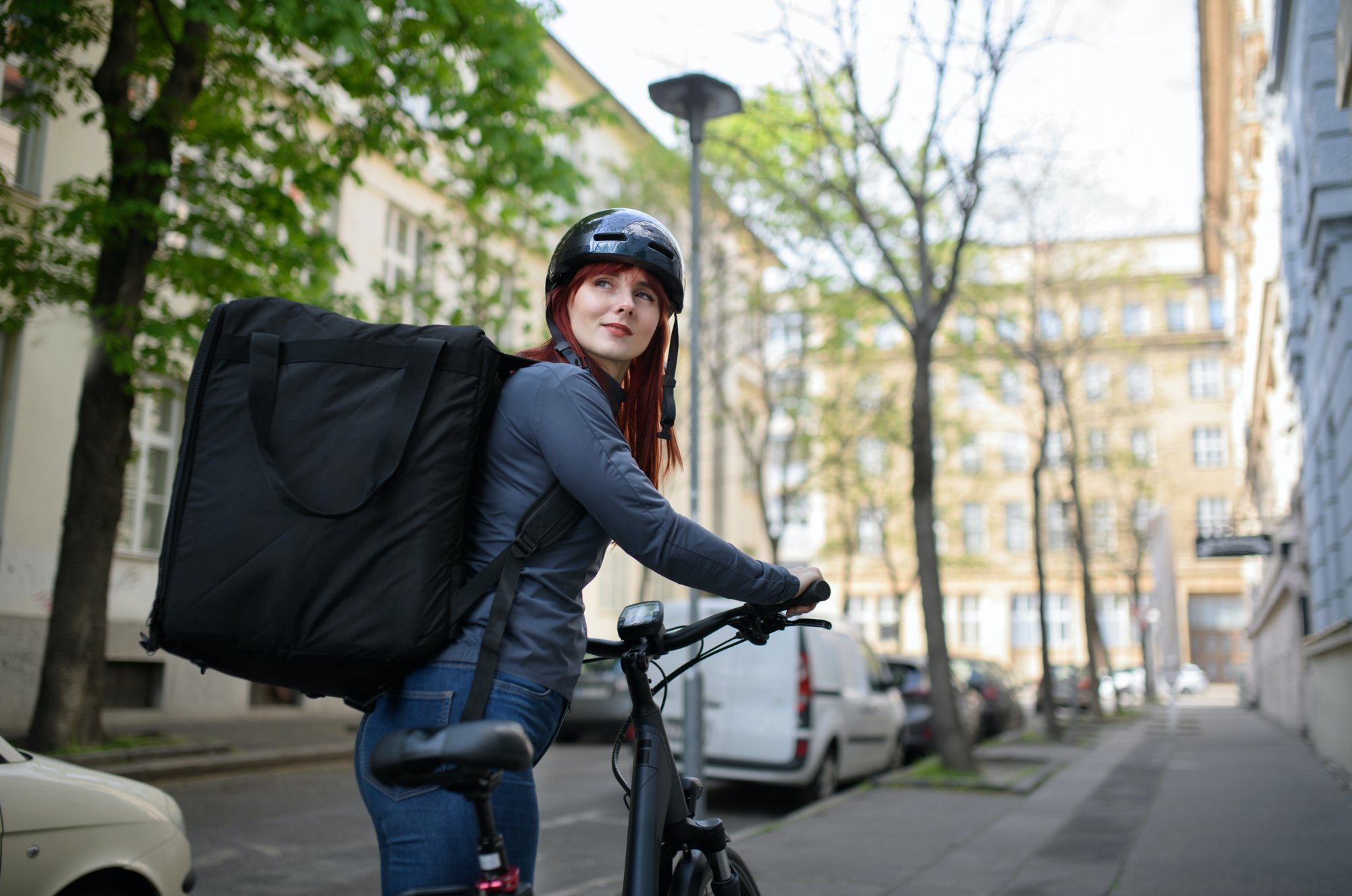 Delivery service woman on bike_high